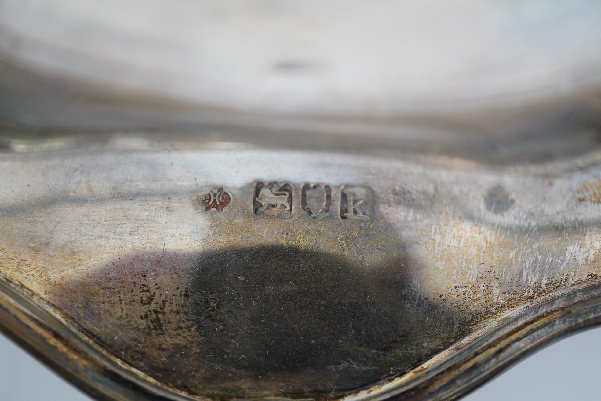 An Edwardian silver cake basket, by William Comyns & Sons Ltd